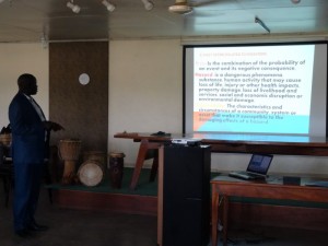 Matthew Jock presenting on disaster response from South Sudan
