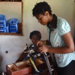 teacher Ephrzie working on a machine