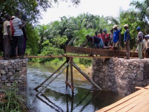 pulling timber across  bridge span