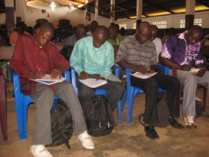 pastors attentively taking notes