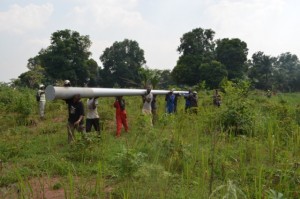 carrying a pole out for installation