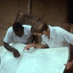 Mbangiye and Brad studying map