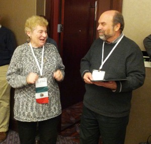 Curt Peterson handing a plaque to Jo Ellen at Midwinter.