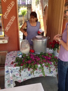 Erika being served some horchata in honor of the Samaritan woman.