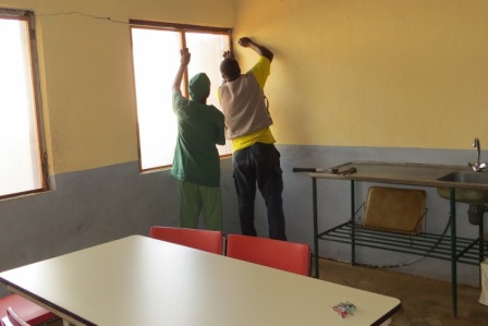 Putting up screens for air and light without bugs in the new coffee break room 
