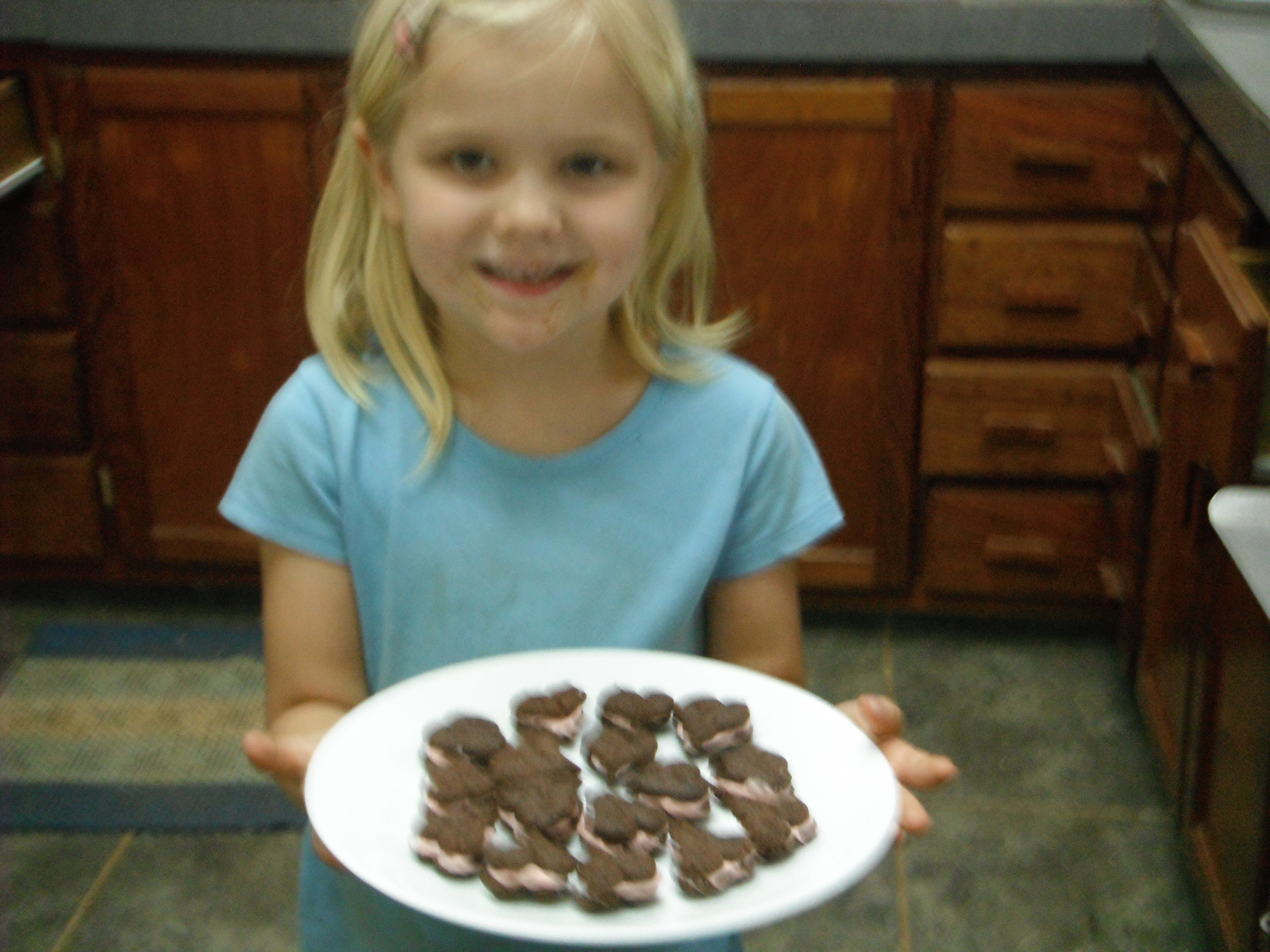 Valentines Day celebrated by baking heart shaped cookies with Ruth.