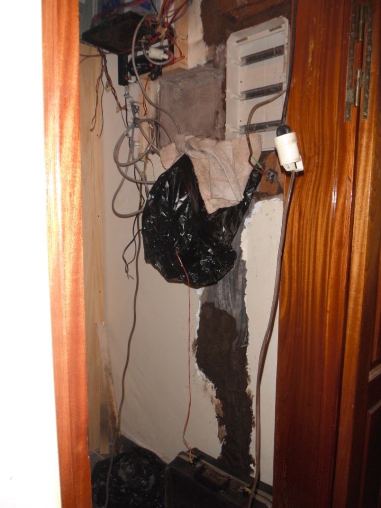 The wall that was chipped away and then the tubes of wire were pulled out.  Only the wiring to the kitchen was burnt in its plastic tube, which had been cracked during installation.