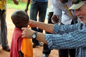 Jerry Penick, Vision Trip team member, meets his sponsored child.