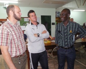 Mr. Noren and Mr. Cone, now teachers at RFIS, visit with a Congolese participant.