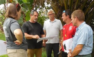 Meeting under the palm tree - trying to visualize a 3 story tall building in the green space before them