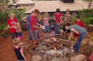 Kids helped get the fire started for roasting hot dogs