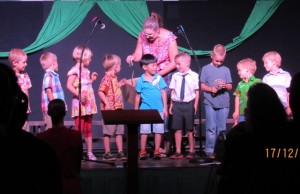 Preschool students perform in song and "musical instruments"