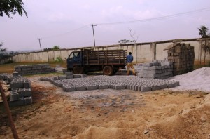 Bricks for the wall are made on site at school.