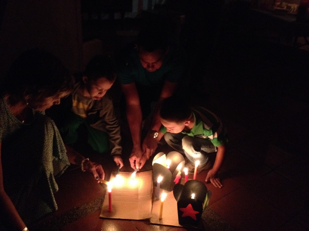LIghting candles on "La noche de las velitas"