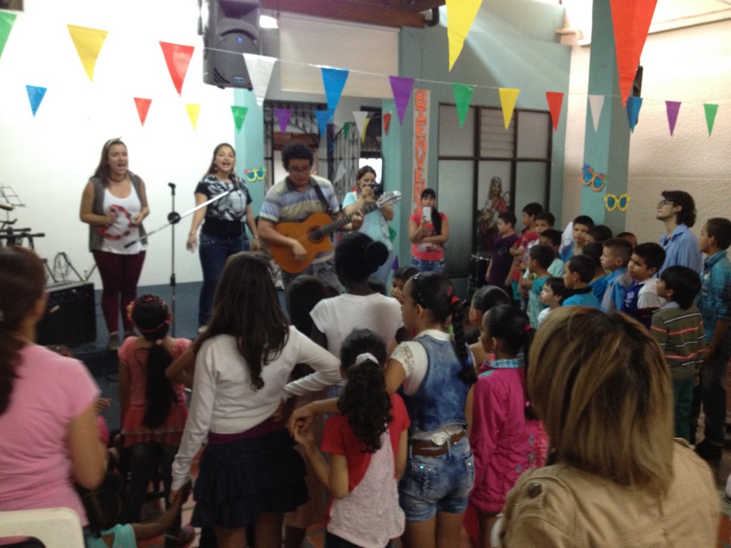 Special moment singing a worship song together and praying over the children