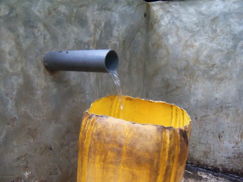 Mai Ya Poto water running into a jug