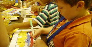 Children participating in a craft as they learn more about life for children in Colombia