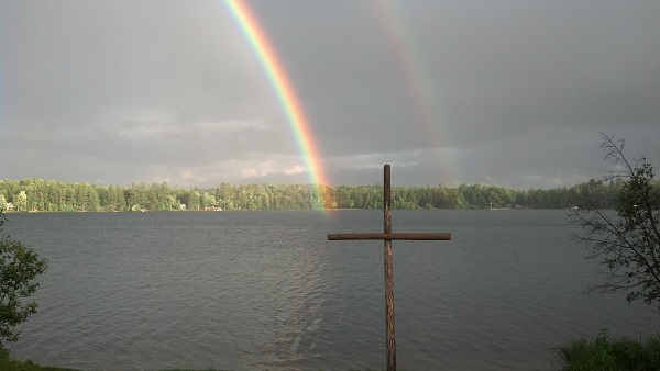 A beautiful rainbow behind the cross