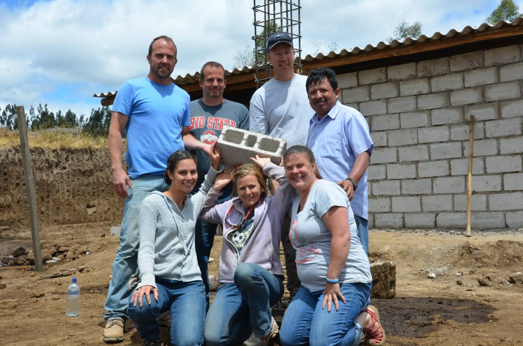 Santiago Partnership group with 1st brick